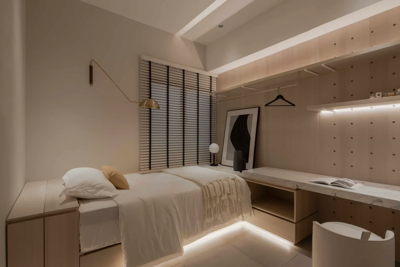 Actual showroom photograph of the Lumina Residences bedroom arranged with a study area